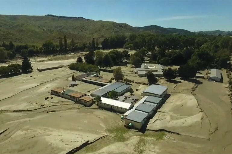 An aerial view of Hukarere taken in May shows tons of piled up silt covering the former gardens, paths, roads and green fields.