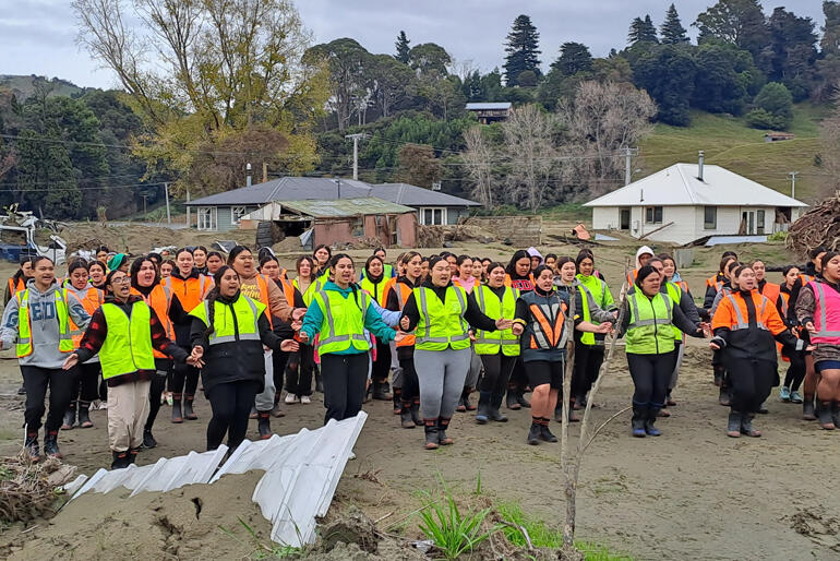 Hukarere Girls' College students perform kapa haka at the devastated site of their former school and home.