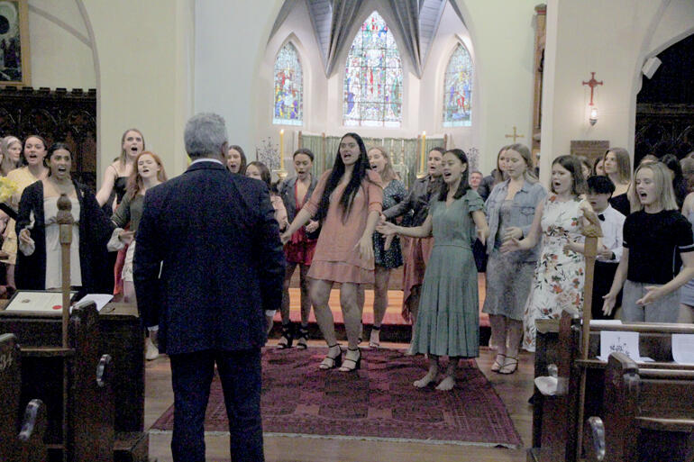 John Walters stands to honour the haka wāhine which is a new College tradition in 2020 (haka were presented in All Saints', due to inclement weather).