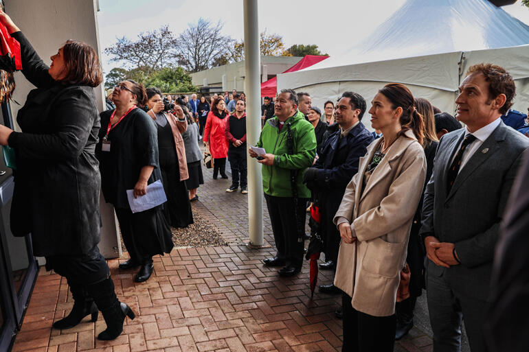 TWROM CEO Dee Ann Wolferstan puts the korowai back up for a second time during the opening ceremony for Te Taanga Manawa.