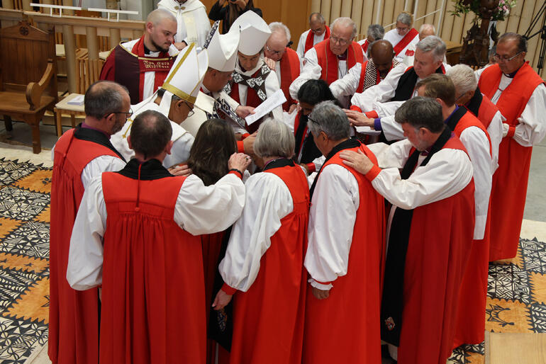 Archbishops and bishops of the Anglican Church in Aotearoa, New Zealand, Polynesia, Australia and Brazil ordain Susan in the laying on of hands.