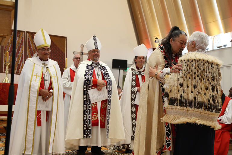 Bishop Susan receives a gift from Māori Women's Welfare League legend Dame Areta Koopu, which she passed on to Susan from Dame Whina Cooper.