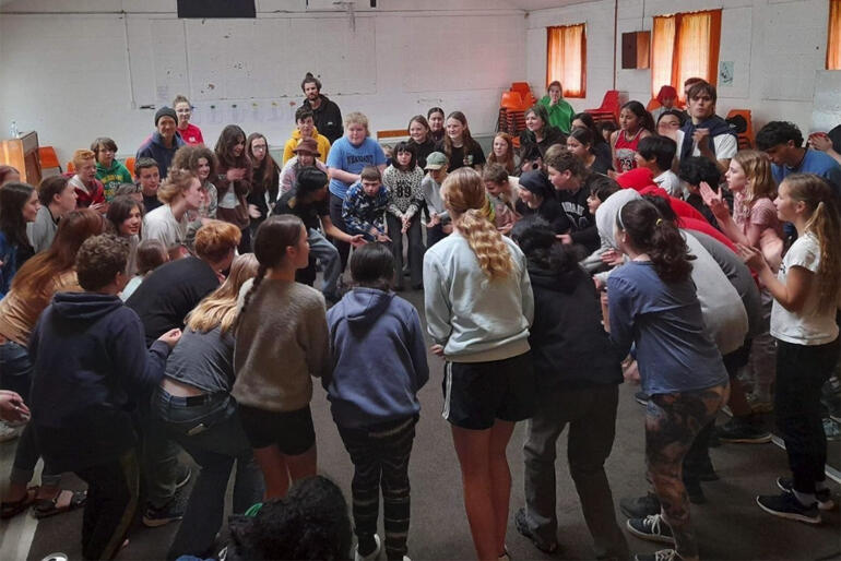 Young teens from Years 7-8 and their Anglican youth leaders take part in a group challenge during the Wellington AYM Intermediate Camp.
