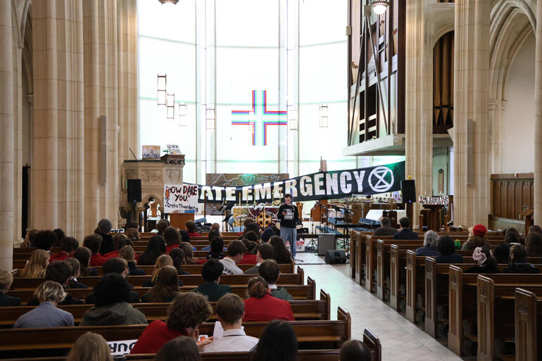 Dunedin school climate strikers fill St Paul's Cathedral as they hear a view from Climate Liberation Aotearoa.