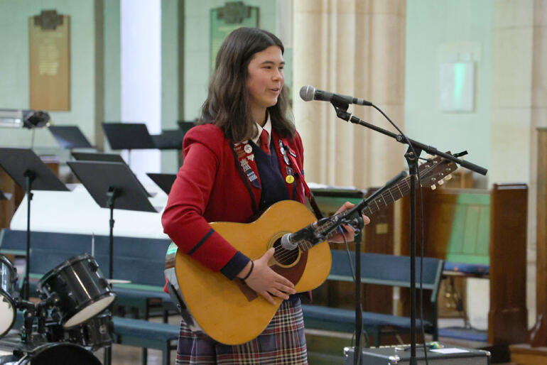 Made Newson from All Saints' Anglican Church and Trinity Envirogroup sings her own composition, 'Paradise'.