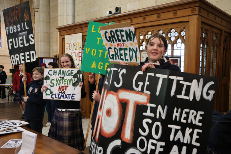 School climate strikers share their placard slogans.