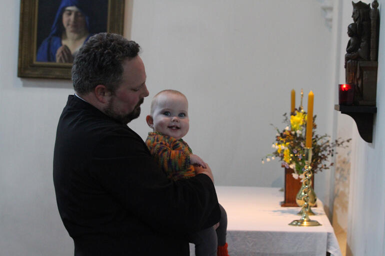 Fr John Graveston and his daughter Poppy join in the mass from Our Lady of Walsingham's alcove at St Peter's Caversham. Fr John Graveston and his daughter Poppy join in the mass from Our Lady of Walsingham's alcove at St Peter's Caversham.