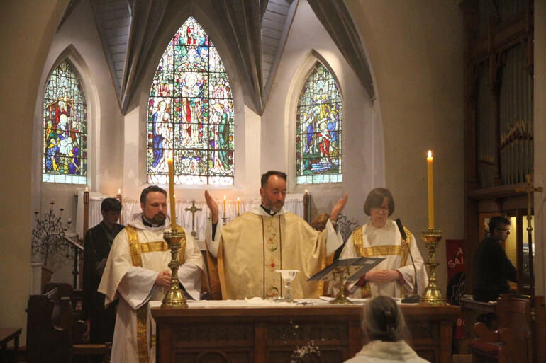 Rev John Graveston, Rev Canon Michael Wallace and Rev Jenny Wilkens serve at All Saints' altar on Friday 16 August. Rev John Graveston, Rev Canon Michael Wallace and Rev Jenny Wilkens serve at All Saints' altar on Friday 16 August.