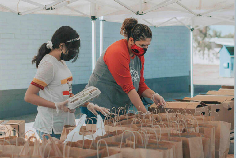 Auckland City Mission volunteers pack food parcels. Photo: https://givealittle.co.nz/fundraiser/nicolas-fundraiser-for-auckland-city-mission