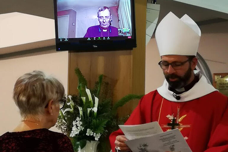 Bishop Andrew Hedge commissions Gail Spence as National Lay Director of Cursillo NZ as Bishop Peter Carrell supports by Zoom.