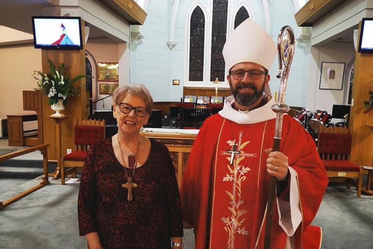 Gail Spence stands in All Saints' Taradale with Bishop Andrew Hedge after her commissioning service as Lay Director of Anglican Cursillo New Zealand.