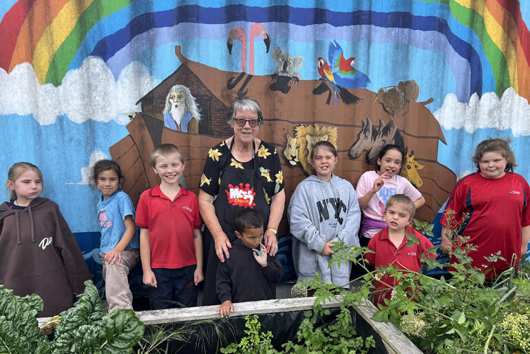 Mary Addison who founded Messy Church at St Paul's Cooperating Parish in Putaruru, grabs a picture with some of the St Paul's children.