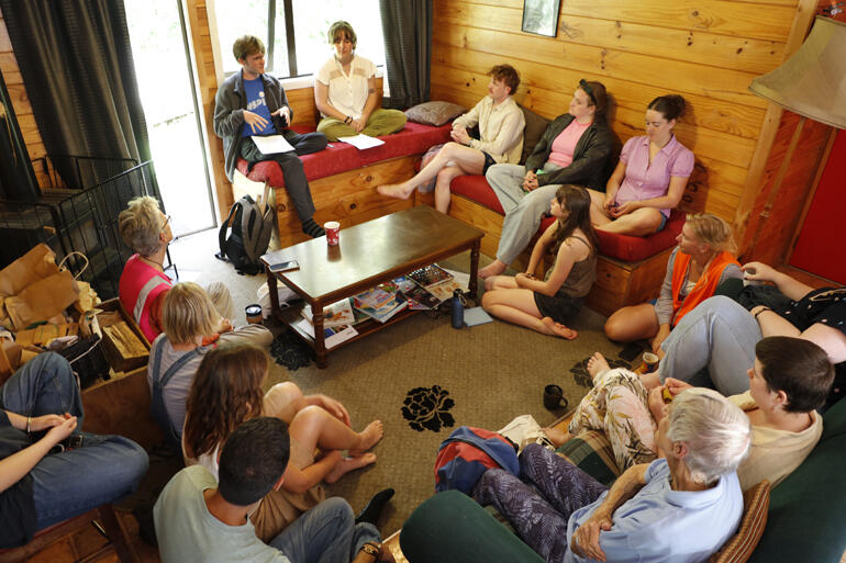 Members of the Ngatiawa River Monastery community and visitors gather in a community meeting.