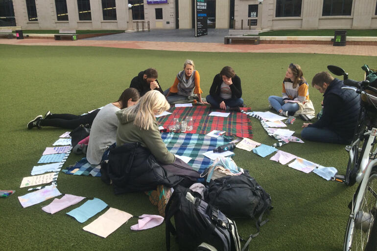 A group of Wellington Anglicans pray at Civic Square before the crowds arrive for the climate strike.