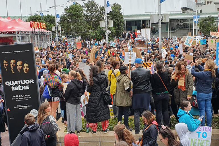Anglicans take up their places in the Auckland throng of climate strikers.