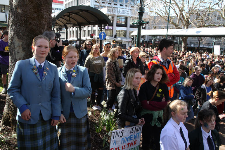 Emma de Lange and Lily Knox from Dunedin diocesan school St Hilda's Collegiate join the climate strike crowd in Dunedin's city centre.