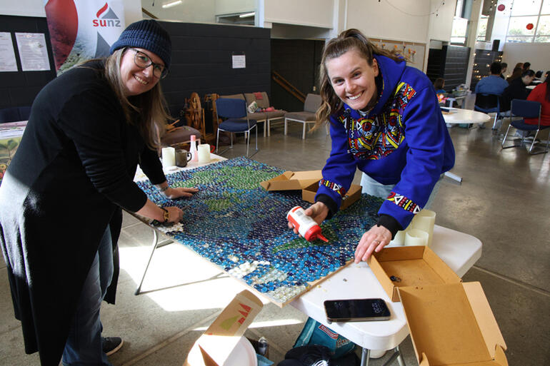 Auckland Diocese Intergenerational ministry coordinator Angela Blundell (L) leads The Abbey's glass pebble mosaic project. Auckland Diocese Intergenerational ministry coordinator Angela Blundell (L) leads The Abbey's glass pebble mosaic project.