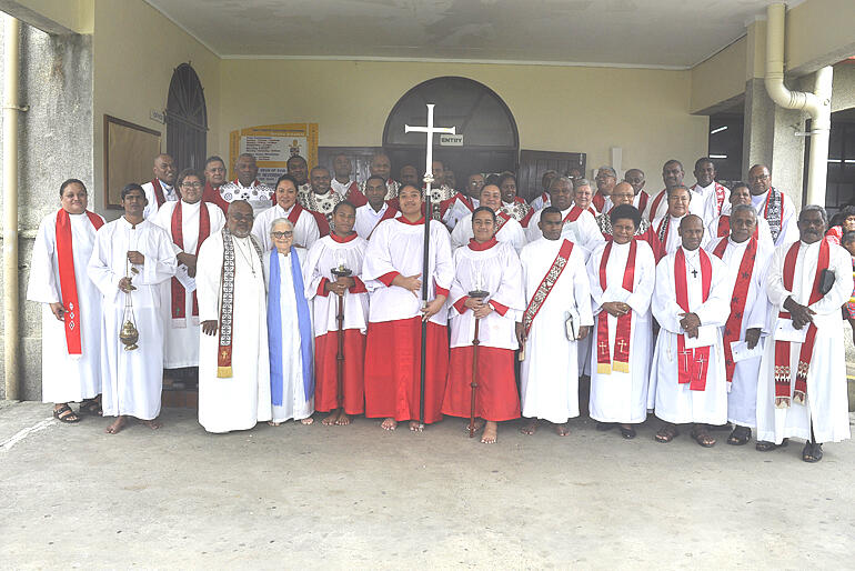 Clergy of the Diocese of Polynesia gather to support the newest of their number.