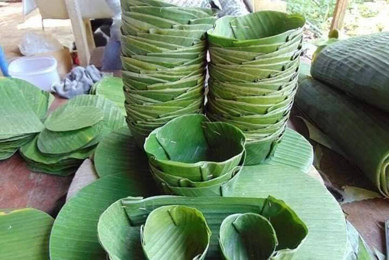 Disposable tableware made the traditional way, with banana leaves, sit ready to hold the food prepared at a 'No Pelestiki' event.