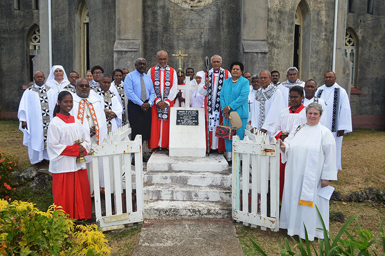 The ministry team around a cairn celebrating the 2004 centenary of Holy Redeemer. The lay couple are the chief and his wife