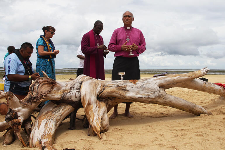 Archbishop Winston Halapua at the sandbank Eucharist - with Archbishop Josiah Idowu-Fearon behind him.