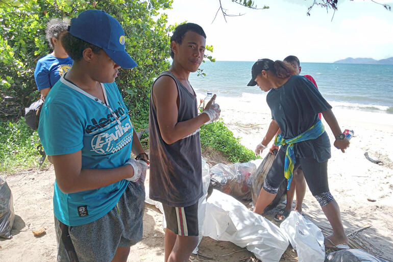 Bule offers a thumbs-up during the Holy Trinity and Holy Family Waidradra beach clean-up day on 23 September 23.
