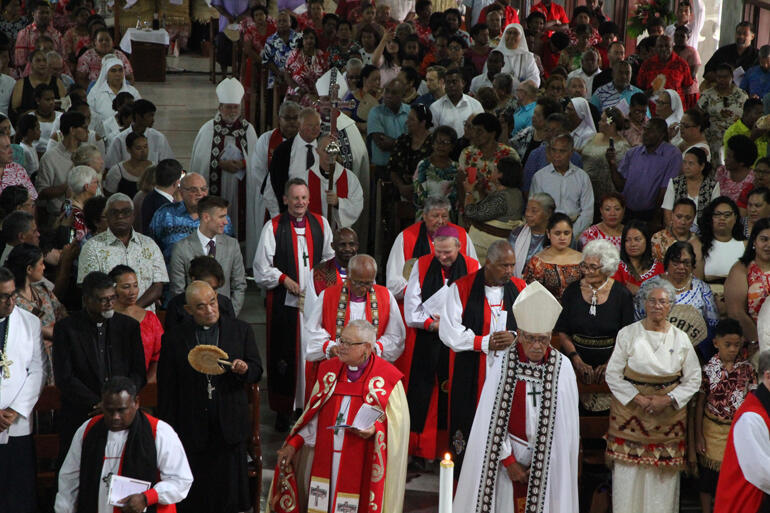 Bishops Richard Wallace and Ngarahu Katene reach the sanctuary during the opening procession.