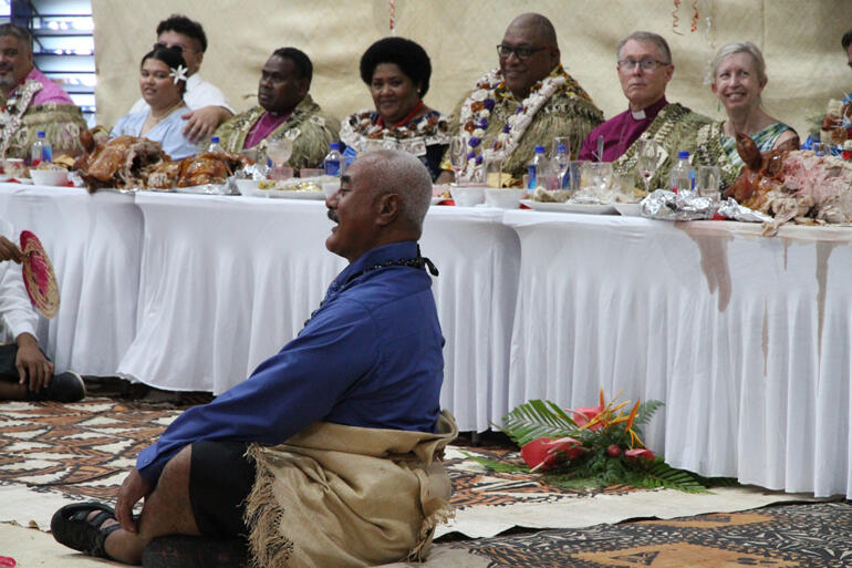 Tevita Tongia sits before the dignitaries table to lead the Tongan community as matapule.