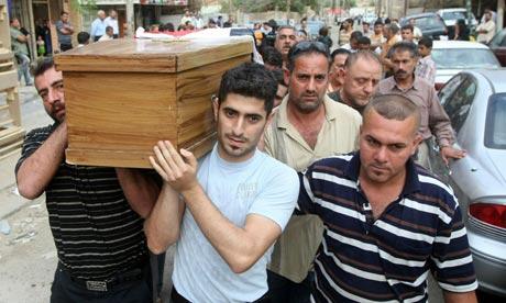 Iraqi Christians carry the coffin of a relative killed at the Our Lady of Salvation church in Baghdad. Photo: Ahmad Al-Rubaye/AFP/Getty Images