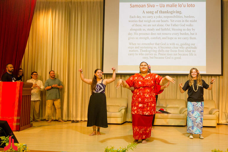 Loini Simeti leads the women in a Samoan siva on cultural night at AEYA 2026.