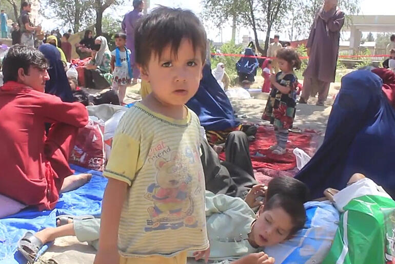 People who have fled Afghanistan's conflict zones shelter in an "internally displaced people's" camp where food and supplies are dangerously low.