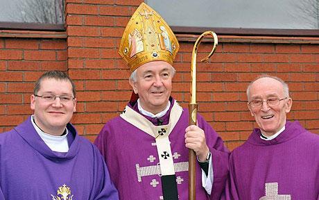 Catholics all: Fr Dominic (left) and Fr Ron (right) with Archbishop Vincent Nichols of Birmingham. Picture, News Team Int.