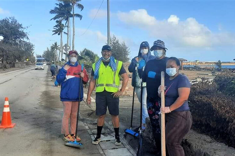 A long road ahead: members of CWS partner Tonga Community Development Trust on post-tsunami clean-up. Image: Marian Kupu/ BroadcomFM