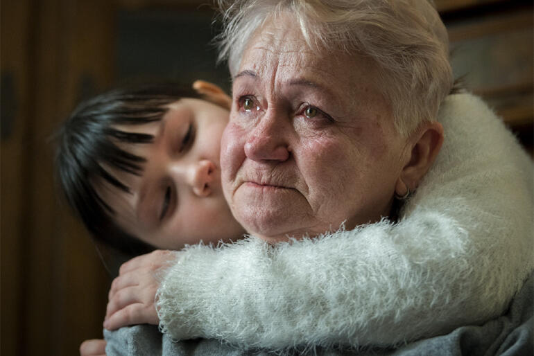 Nataliia and granddaughter Lia recall loved ones in Ukraine. They now live in Poland in a house with six other refugee families. Nataliia and granddaughter Lia recall loved ones in Ukraine. They now live in Poland in a house with six other refugee families.
