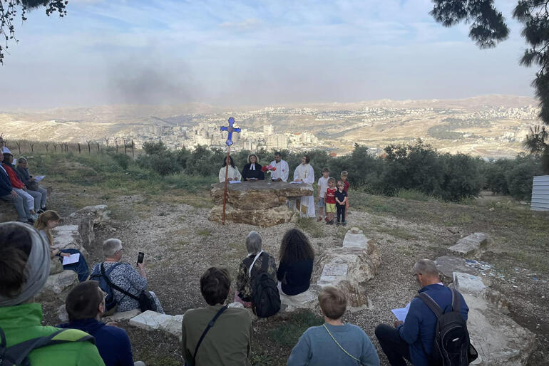 Pilgrims from St George's College gather on the Mount of Olives to share the Eucharist on Ascension Day. Pilgrims from St George's College gather on the Mount of Olives to share the Eucharist on Ascension Day.