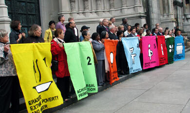 Rally participants highlight the MDGs on the steps of St John the Divine in New York.