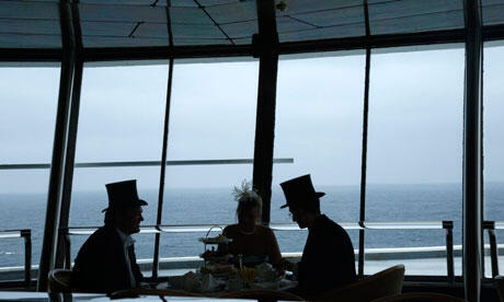 Passengers enjoy traditional afternoon tea during the Titanic Memorial Cruise in the mid-Atlantic. Photo: Chris Helgren